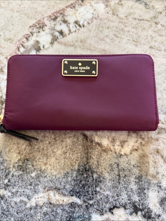 kate spade Handbags - kate spade Plum Leather Zip Wallet with Gold Plaque